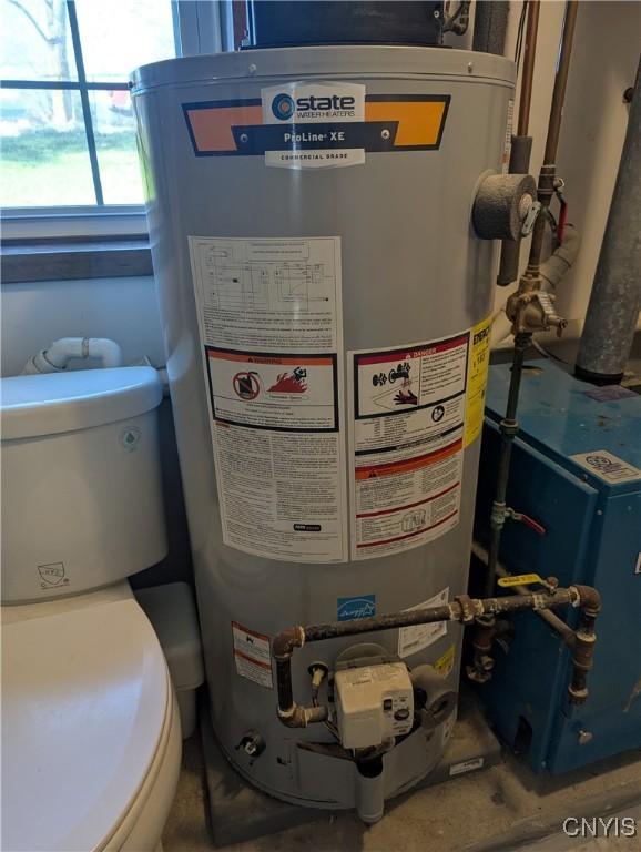 utilities featuring water heater and a heating unit