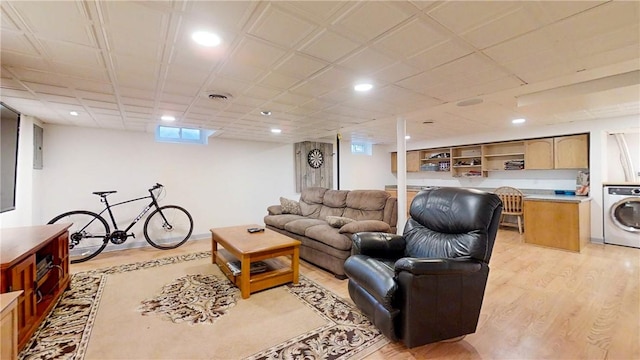 living area with recessed lighting, light wood finished floors, and washer / clothes dryer