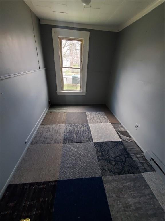 spare room with baseboards