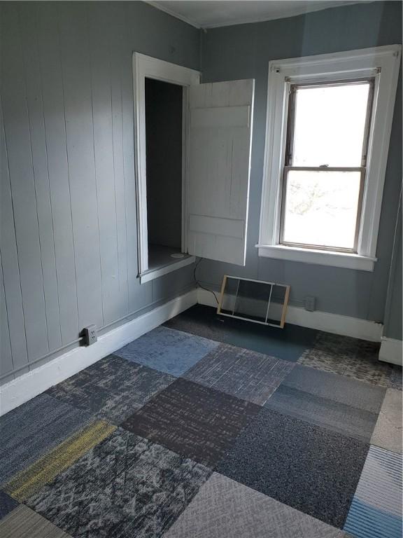 spare room featuring baseboards