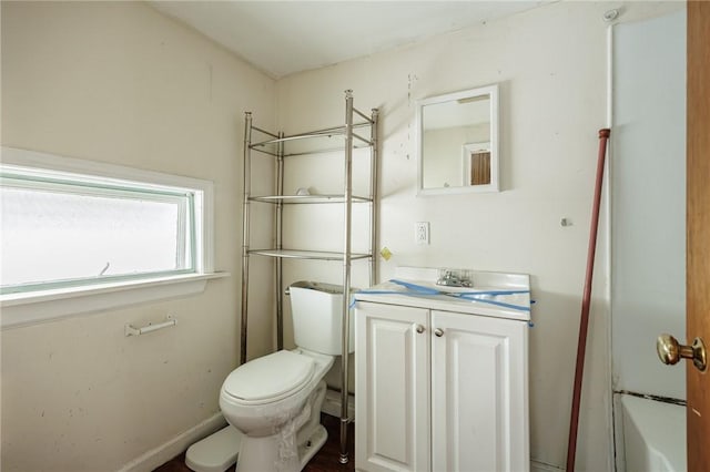 bathroom featuring toilet and vanity