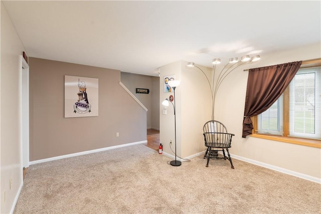 unfurnished room with baseboards and carpet flooring