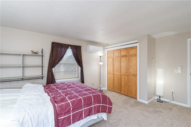 carpeted bedroom featuring baseboards, a closet, and a wall unit AC