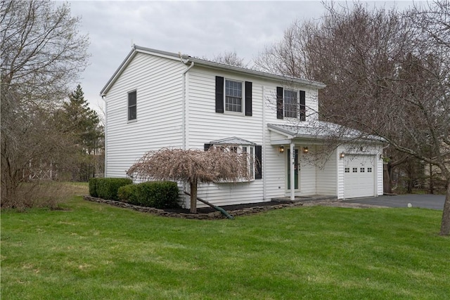 traditional home with driveway and a front yard