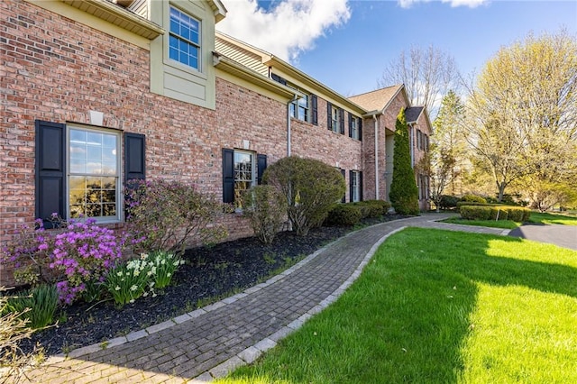 5 Ponds Edge Way, Pittsford, NY 14534 - view of home's exterior with brick siding and a yard