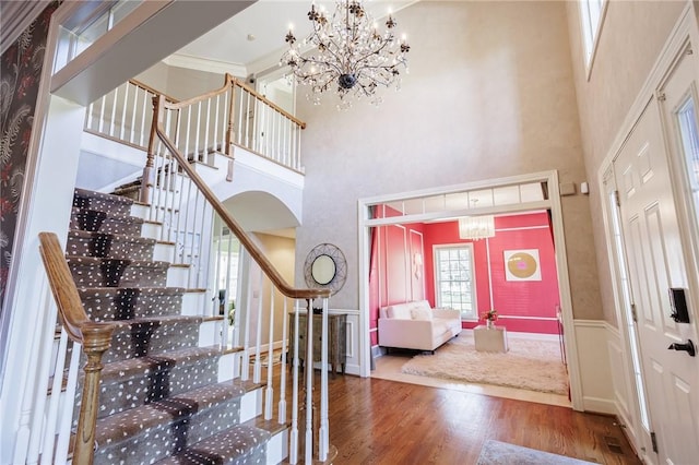 5 Ponds Edge Way, Pittsford, NY 14534 - entrance foyer featuring a towering ceiling, visible vents, a chandelier, wood finished floors, and stairs