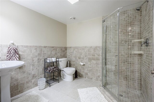 5 Ponds Edge Way, Pittsford, NY 14534 - full bath featuring tile walls, tile patterned floors, a stall shower, and a wainscoted wall