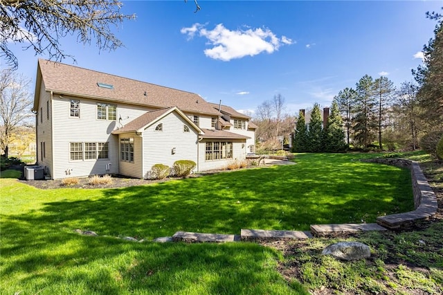 5 Ponds Edge Way, Pittsford, NY 14534 - rear view of house with a yard and central air condition unit