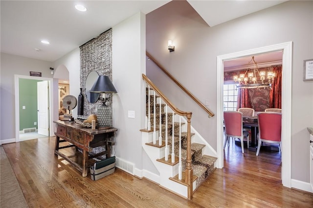 5 Ponds Edge Way, Pittsford, NY 14534 - staircase featuring arched walkways, wood finished floors, and visible vents