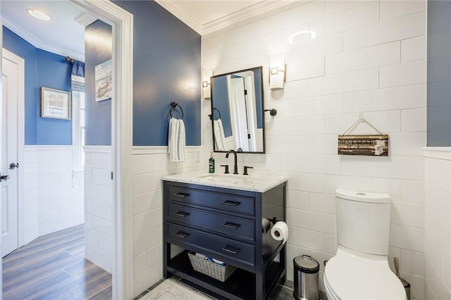 5 Ponds Edge Way, Pittsford, NY 14534 - bathroom featuring toilet, tile walls, wood finished floors, vanity, and ornamental molding