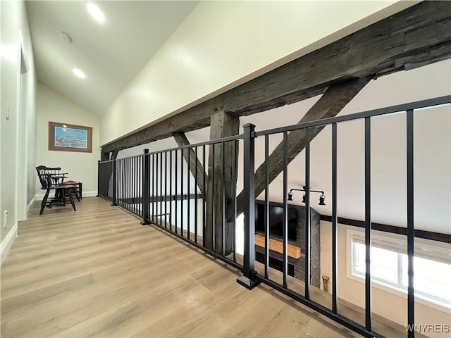 interior space with recessed lighting, vaulted ceiling, wood finished floors, and baseboards