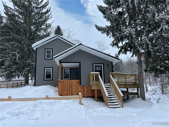 view of front of house featuring a wooden deck and stairs