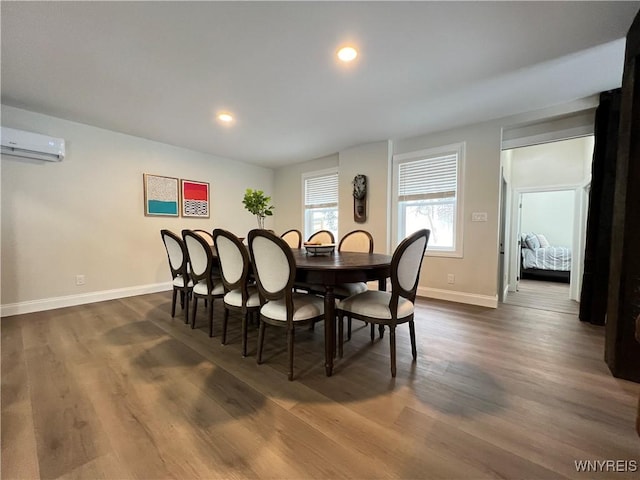 dining area with recessed lighting, baseboards, dark wood-style floors, and a wall unit AC