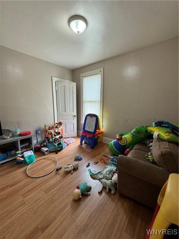 game room with wood finished floors and baseboards