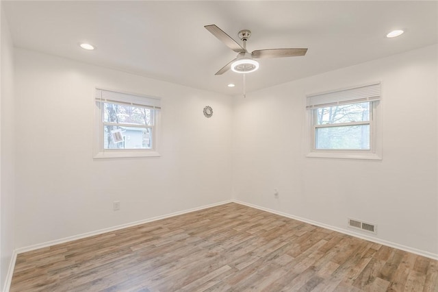 unfurnished room with recessed lighting, light wood-style flooring, visible vents, and a ceiling fan