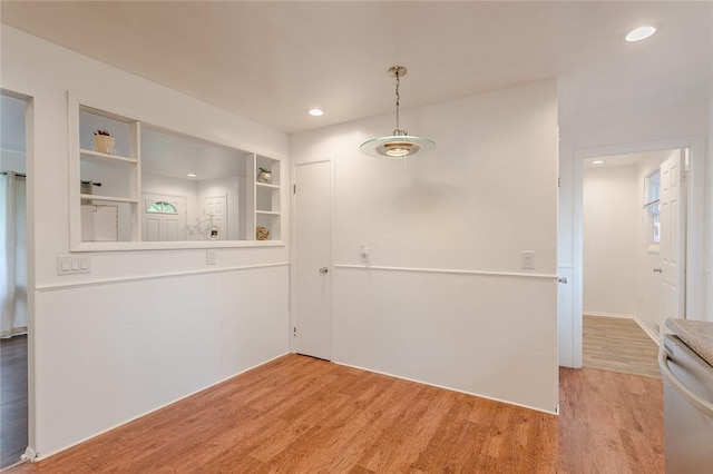 unfurnished dining area with recessed lighting and light wood-type flooring