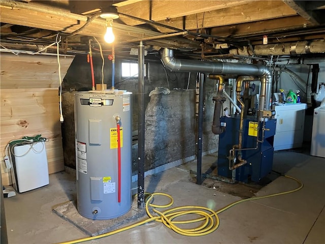 utilities featuring washing machine and dryer, electric water heater, and gas water heater