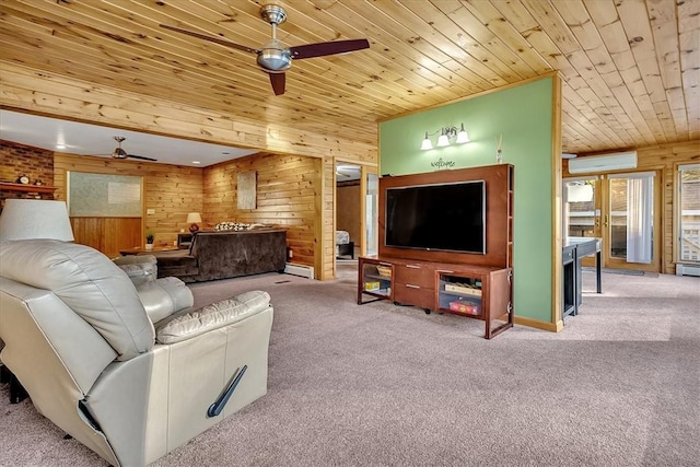 carpeted living room with ceiling fan, an AC wall unit, and wooden walls