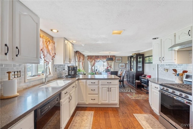 19 Whig Hill Rd, West Monroe, NY 13167 - kitchen featuring gas range, under cabinet range hood, black dishwasher, a sink, and a peninsula