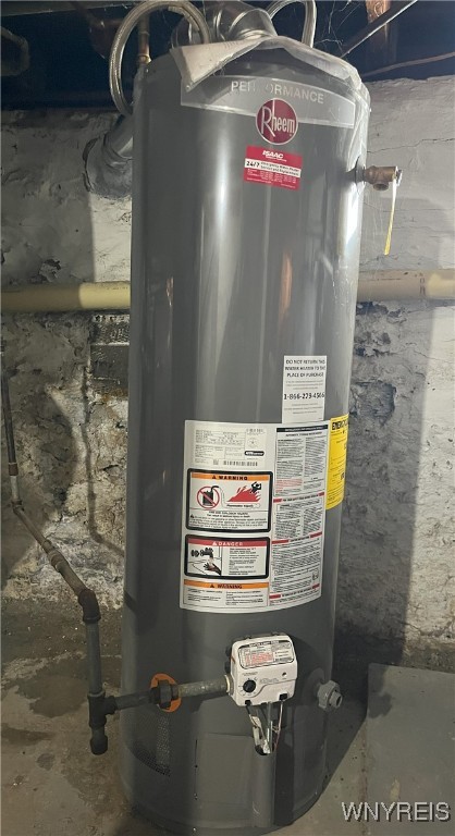 utility room with water heater