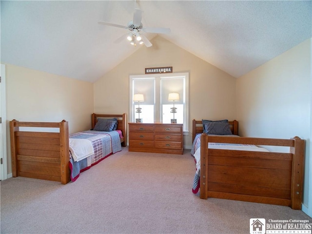 carpeted bedroom with ceiling fan and lofted ceiling