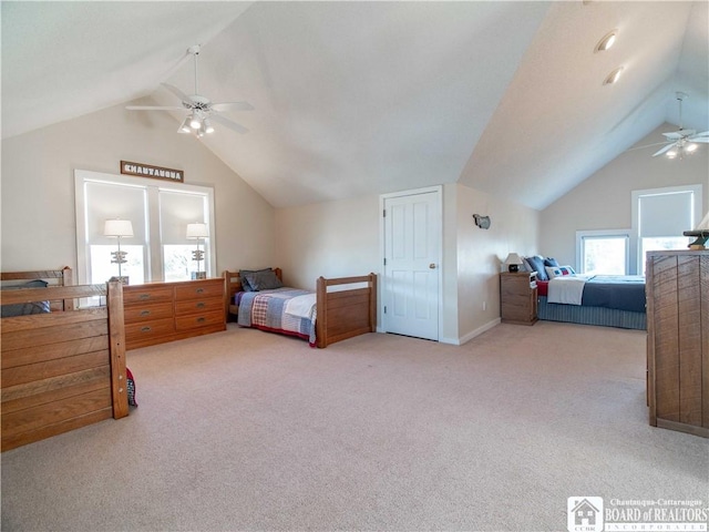 bedroom featuring vaulted ceiling, carpet, and a ceiling fan