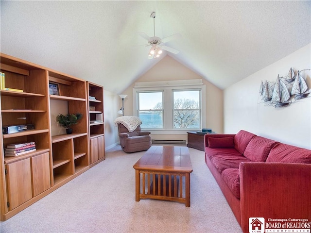 carpeted living room with a baseboard heating unit, vaulted ceiling, and ceiling fan