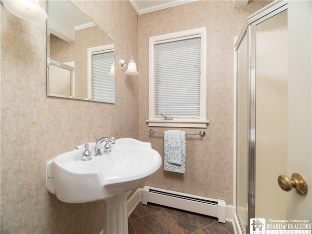 full bathroom with baseboard heating, baseboards, ornamental molding, and a stall shower