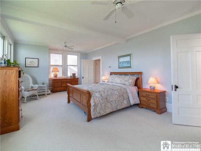 carpeted bedroom featuring crown molding and ceiling fan