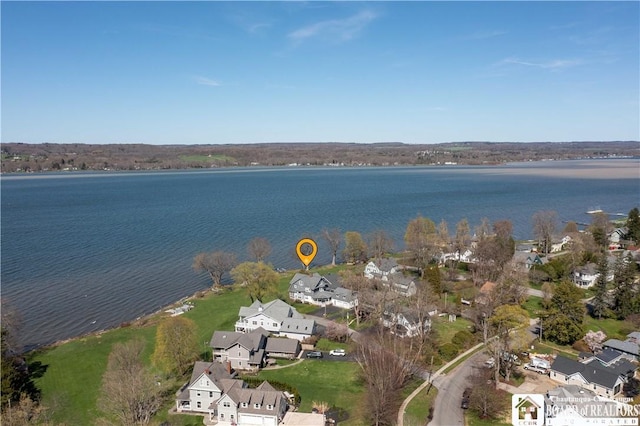 birds eye view of property with a residential view and a water view