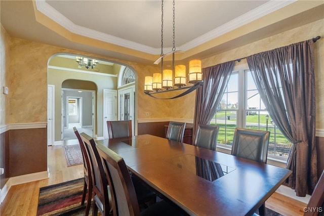 6455 Electric Railway, Cicero, NY 13039 - dining area featuring an inviting chandelier, wood finished floors, arched walkways, and ornamental molding