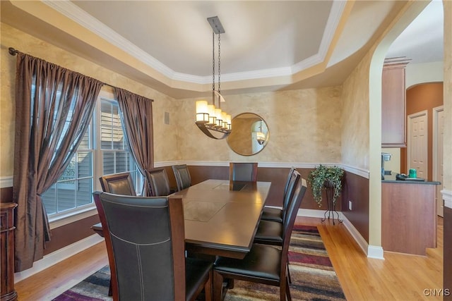 6455 Electric Railway, Cicero, NY 13039 - dining room with arched walkways, wood finished floors, ornamental molding, and an inviting chandelier
