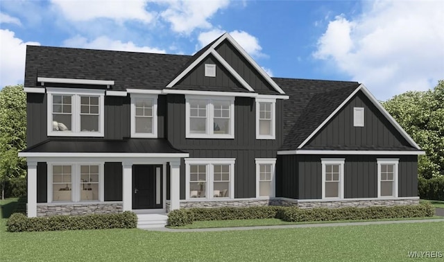 69 Woodthrush Trl, Orchard Park, NY 14127 - view of front facade with a shingled roof, stone siding, a front lawn, and board and batten siding