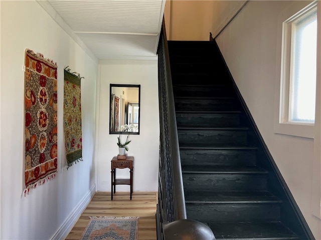 stairs with wood finished floors