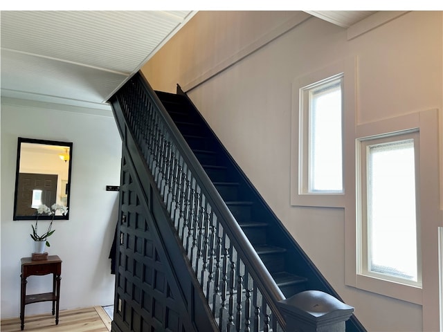stairway with wood finished floors
