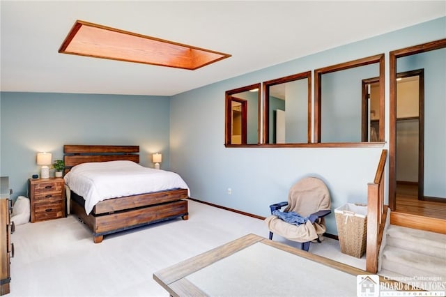 carpeted bedroom with baseboards