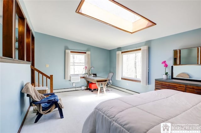 bedroom featuring a baseboard radiator, carpet, lofted ceiling with skylight, and multiple windows