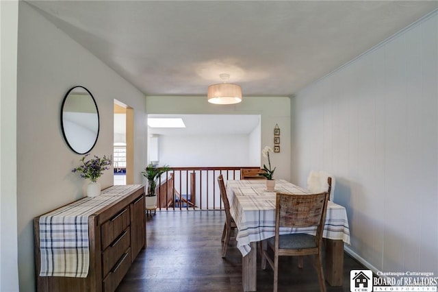 dining space with dark wood finished floors