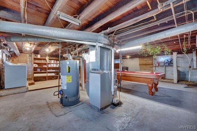 269 S Main St, Wellsville, NY 14895 - basement featuring pool table, heating unit, and gas water heater