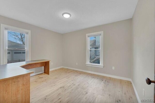 269 S Main St, Wellsville, NY 14895 - spare room featuring light wood-style floors and baseboards