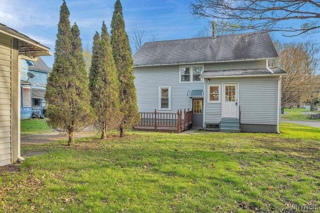 269 S Main St, Wellsville, NY 14895 - rear view of property with a wooden deck, entry steps, and a lawn