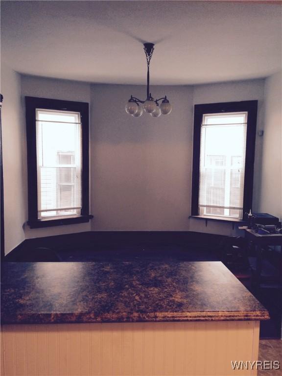 dining room featuring a chandelier and a healthy amount of sunlight