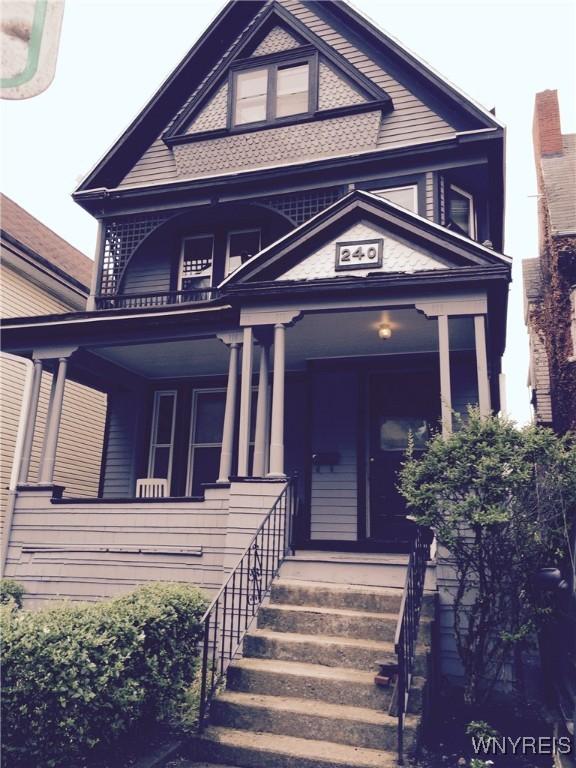 victorian home with covered porch and a balcony