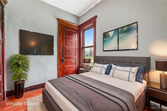 bedroom with wood finished floors