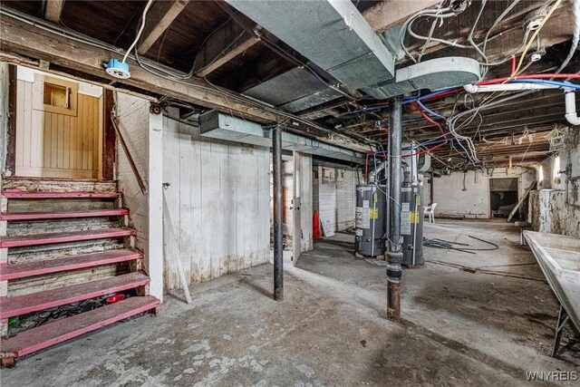 unfinished below grade area with water heater and stairs
