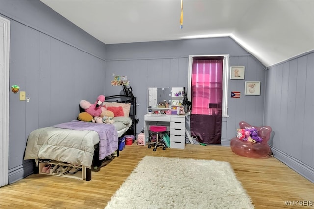 bedroom featuring vaulted ceiling and wood finished floors
