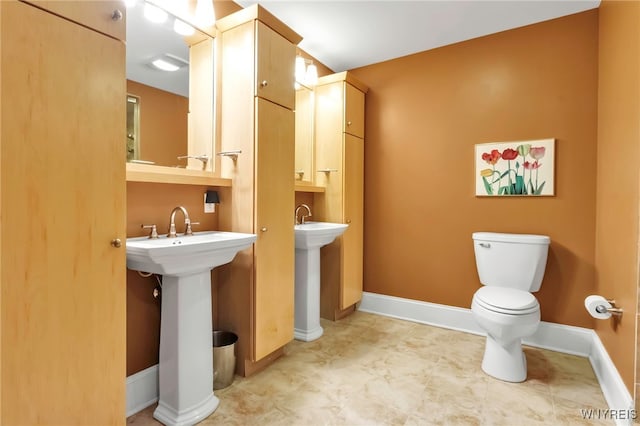 132 Lakefront Blvd Unit 504, Buffalo, NY 14202 - bathroom with toilet and baseboards