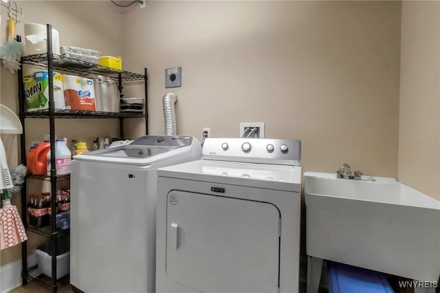 132 Lakefront Blvd Unit 504, Buffalo, NY 14202 - clothes washing area featuring a sink, washer and dryer, and laundry area