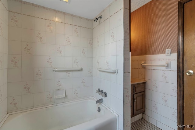 full bathroom with tile walls and bathing tub / shower combination
