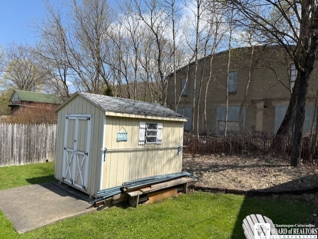 view of shed with fence